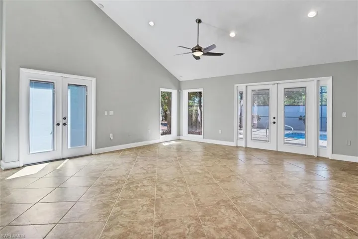 Living Room vacant. Light and bright with lots of window and french doors