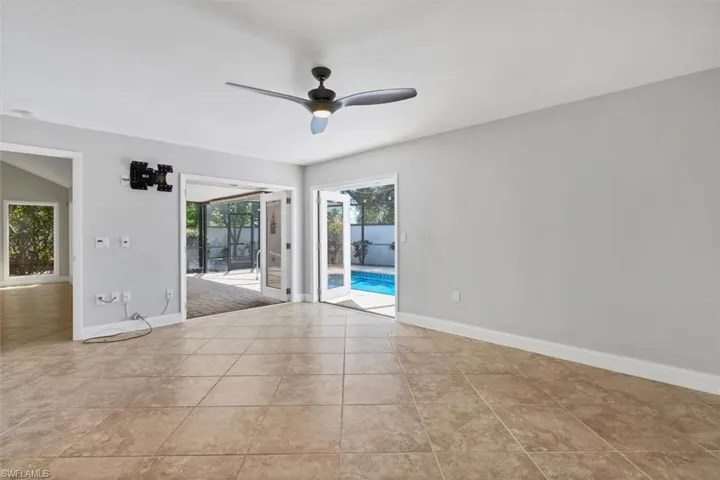 Master bedroom with french doors open to lanai