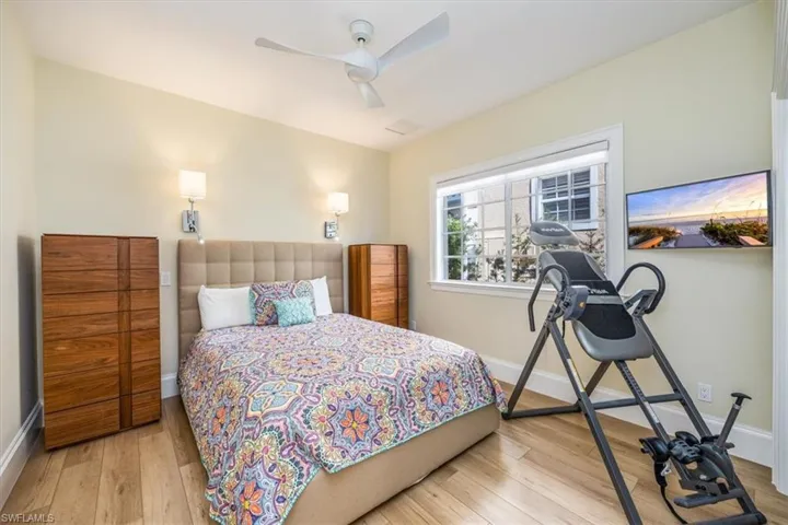 Bedroom with light wood-type flooring and ceiling fan