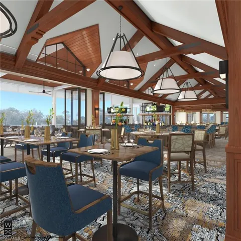 Dining space featuring beamed ceiling and high vaulted ceiling