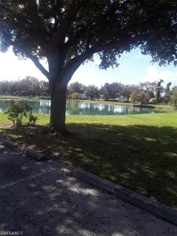 View of yard with a water view
