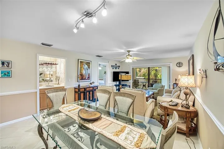 Dining space with light tile patterned floors and ceiling fan