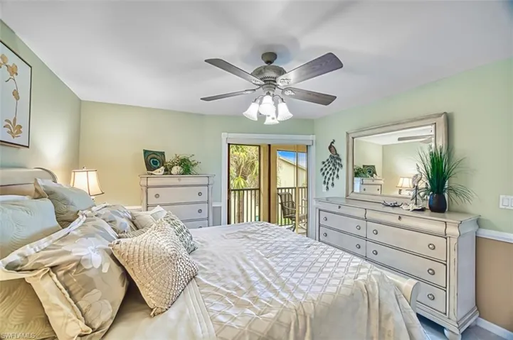 Bedroom with access to exterior and ceiling fan