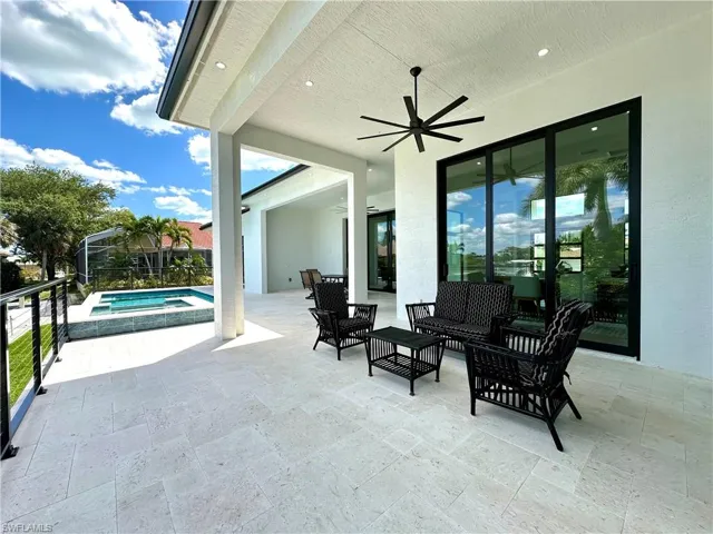 View of patio / terrace with a ceiling fan, an outdoor hangout area, and a pool with connected hot tub