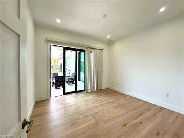Spare room with light wood-style floors and recessed lighting
