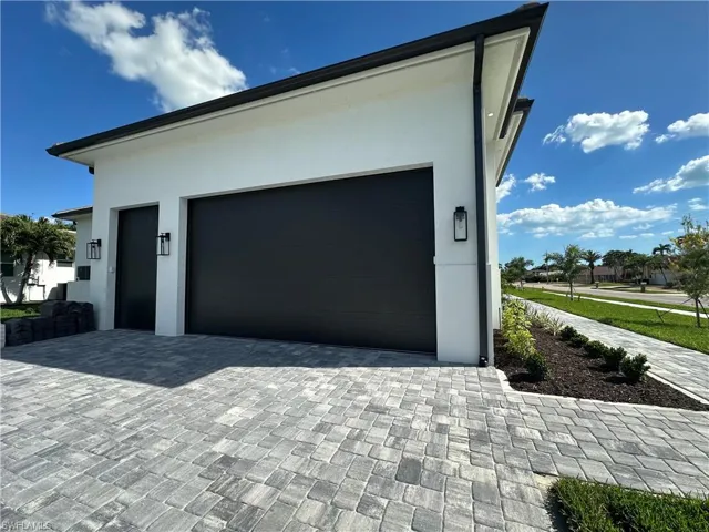 Garage with decorative driveway