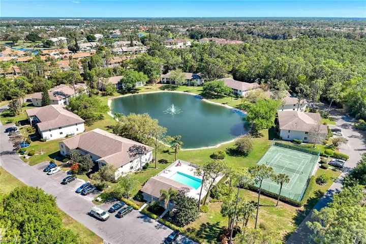 Birds eye view of property with a residential view and a water view