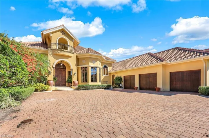 Mediterranean / spanish-style house featuring a balcony and a garage