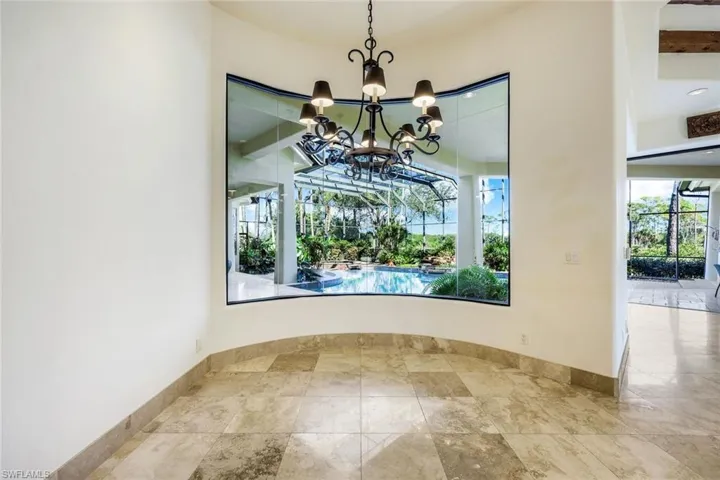 Unfurnished dining area with a chandelier