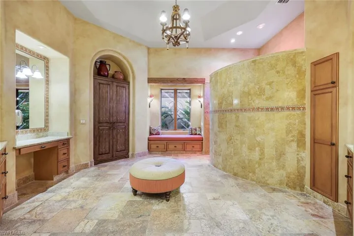 Bathroom with vanity and an inviting chandelier