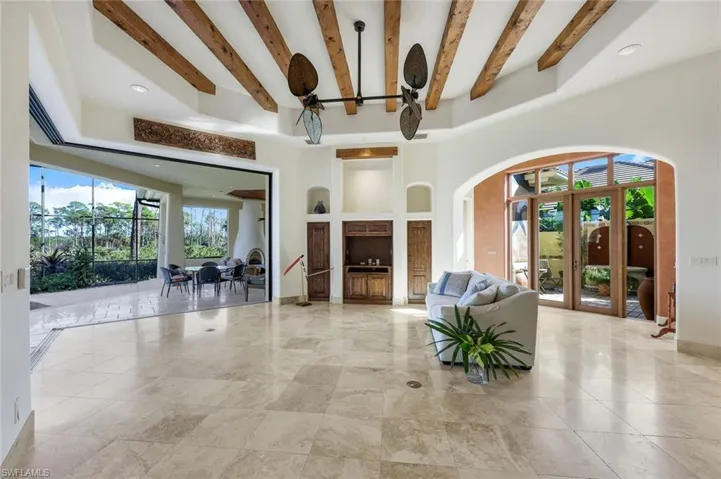 Living room featuring beamed ceiling