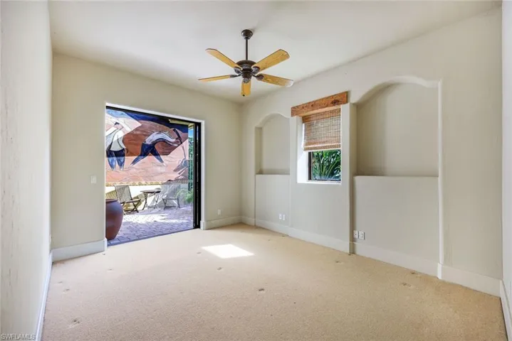 Unfurnished room with light carpet and ceiling fan