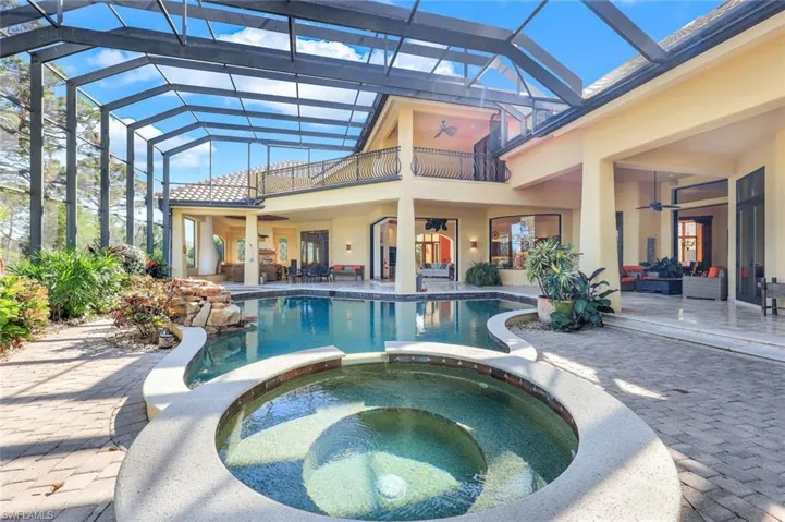 View of swimming pool with an in ground hot tub, an outdoor living space, ceiling fan, and a patio area