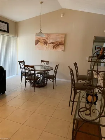 Dining room featuring baseboards and light tile patterned flooring