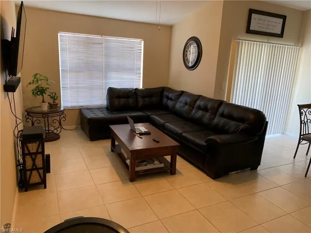 Living area featuring light tile patterned floors
