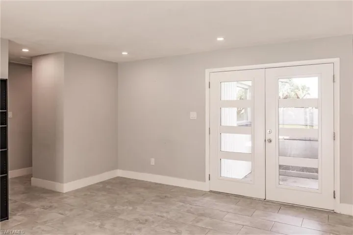 Foyer entrance with french doors and recessed lighting