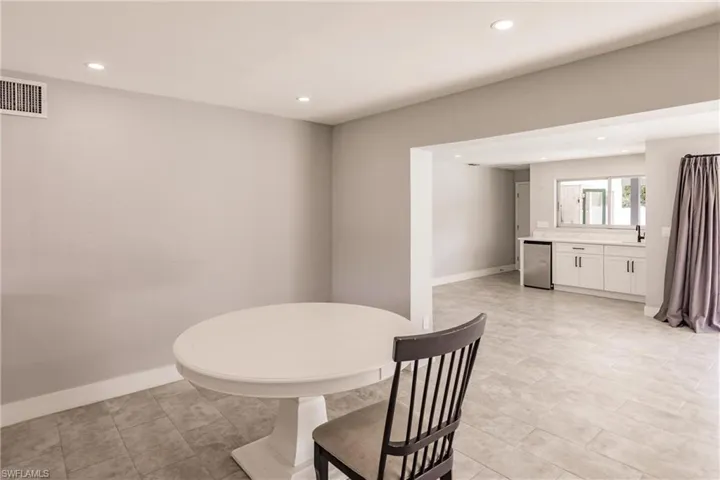 Dining area featuring baseboards and recessed lighting