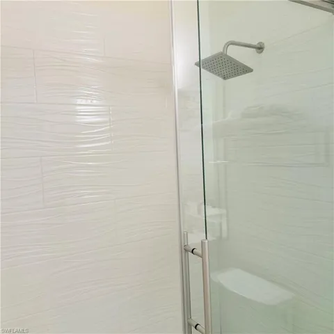 Full bath featuring a stall shower