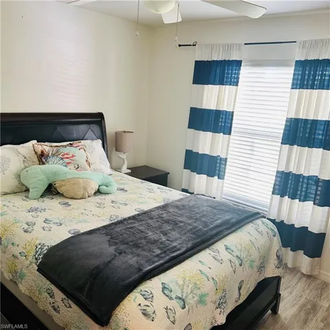 Bedroom featuring ceiling fan and wood finished floors