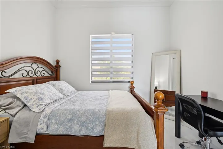 Bedroom with hardwood / wood-style floors