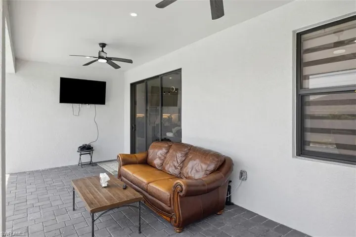 View of patio featuring ceiling fan