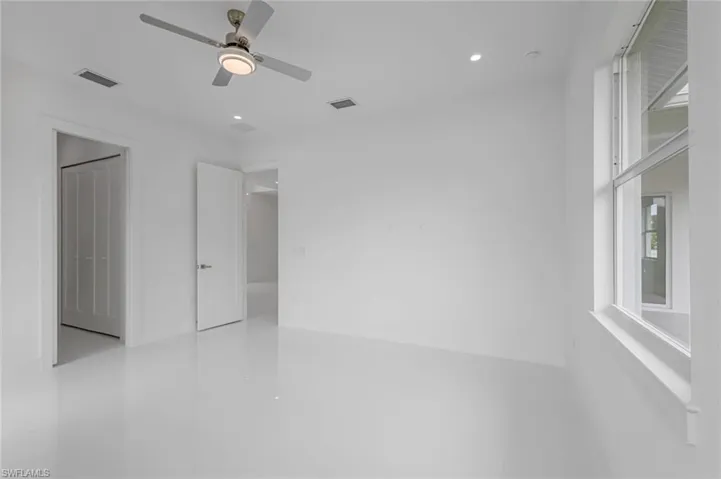 Spare room with ceiling fan