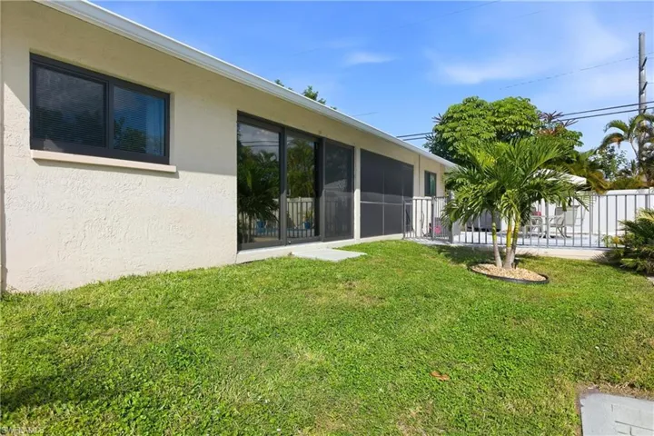 View of yard featuring a sunroom