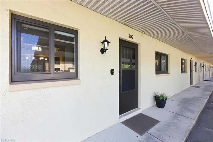 View of exterior entry with stucco siding