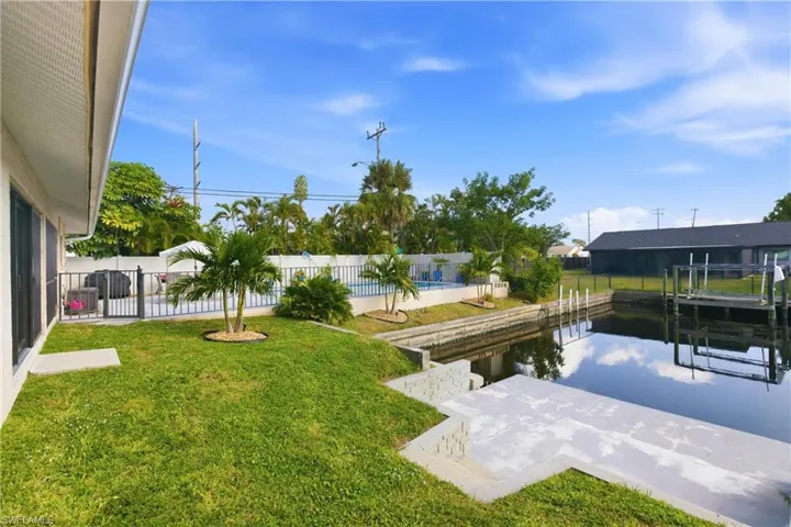 Dock area featuring a fenced backyard and a patio area