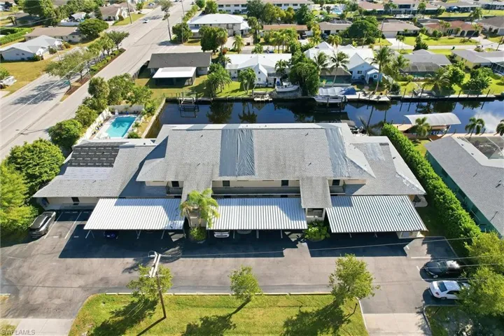 Aerial view of residential area featuring a large body of water