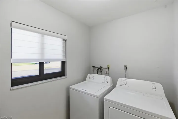Laundry area featuring independent washer and dryer
