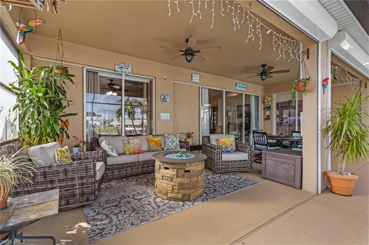 View of patio / terrace with an outdoor living space with a fire pit