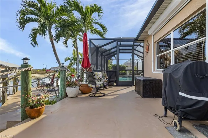 View of patio featuring a lanai and grilling area