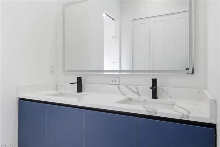 Bathroom featuring double vanity