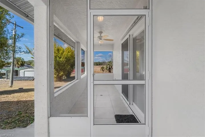 Screen lanai entrance to the private guest bedroom