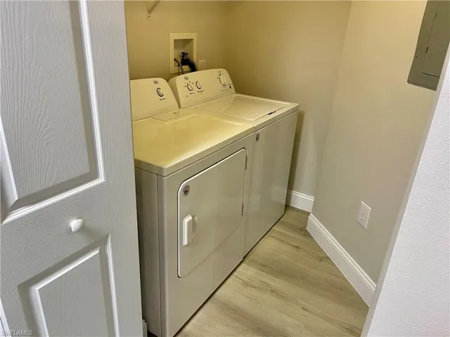 In-unit laundry room featuring a washer and dryer for added convenience.