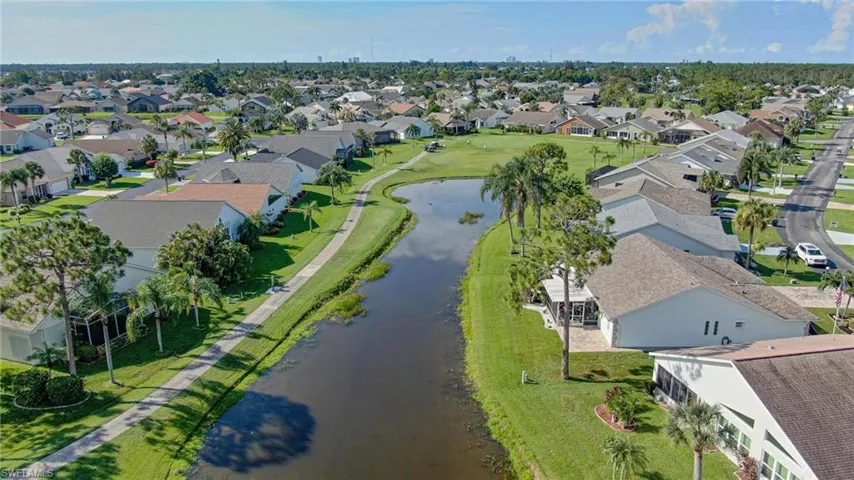 Aerial perspective of suburban area with a nearby body of water