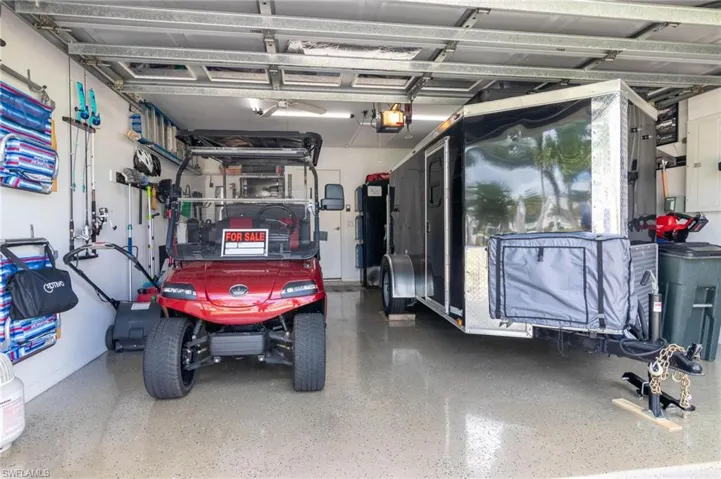 Garage featuring a garage door opener
