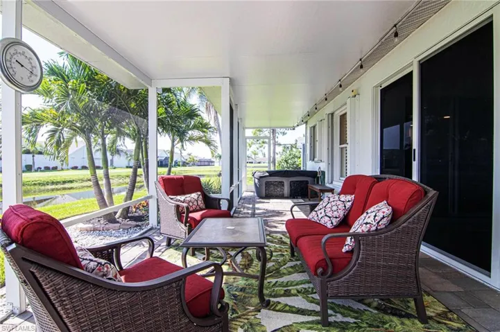 Sunroom / solarium with outdoor lounge area and a water view