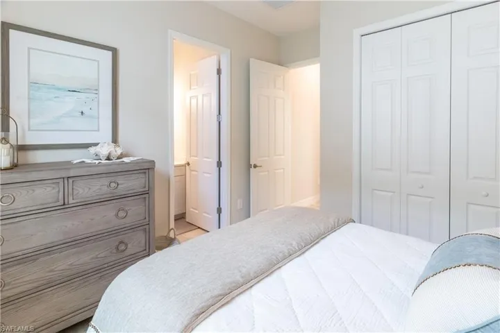 Bedroom with connected bathroom and a closet