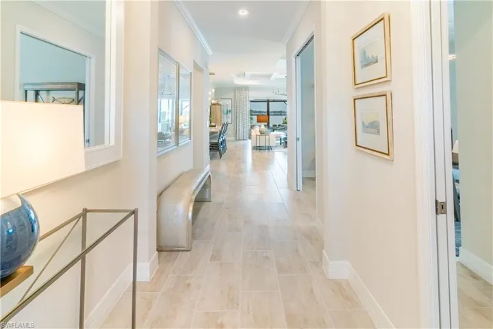 Corridor featuring crown molding