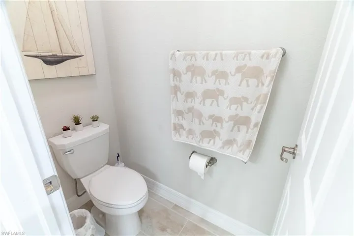 Bathroom featuring toilet and tile patterned flooring