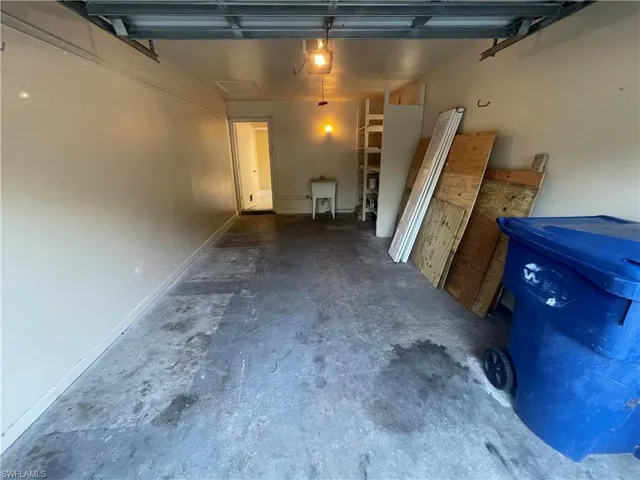 Garage featuring baseboards