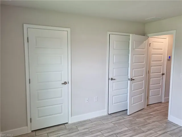 Unfurnished bedroom with light hardwood / wood-style floors