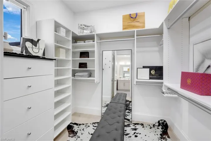 Spacious primary closet with build out