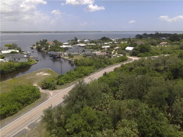 Partial view of lot including neighboring homes in background