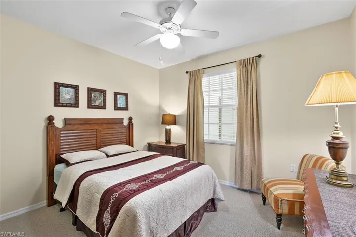 Bedroom with carpet flooring and ceiling fan