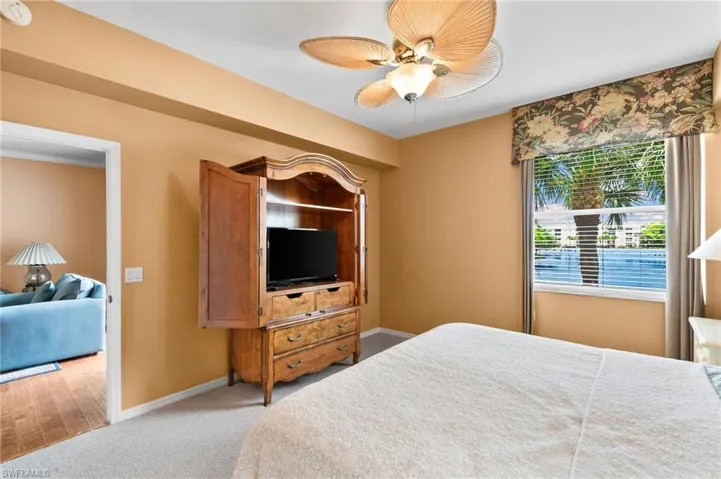 Bedroom featuring carpet and ceiling fan
