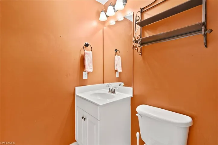 Bathroom featuring oversized vanity and toilet