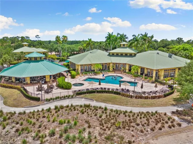 View of pool with an in ground hot tub, restaurant, and seating
